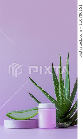 Arrangement of aloe skincare products, delicate containers set with aloe vera leaves on a pastel lavender vertical background Arrangement of aloe skincare products, delicate containers set with aloe vera leaves on a pastel lavender vertical background 110700151