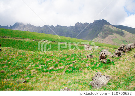 Landscape high mountains in dense fog tops of mountains in clouds North Caucasus Elbrus Landscape high mountains in dense fog tops of mountains in clouds North Caucasus Elbrus 110700622
