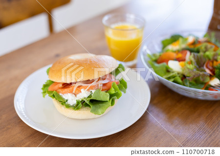 Bagels and salad on the table Bagels and salad on the table 110700718