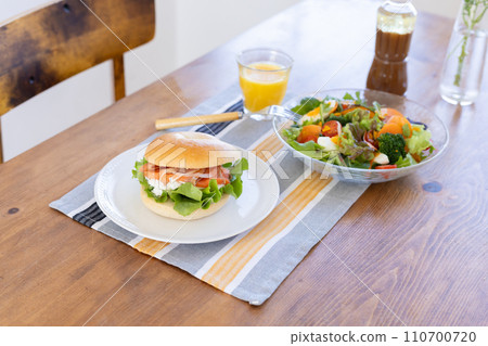 Bagels and salad on the table Bagels and salad on the table 110700720