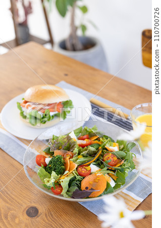Bagels and salad on the table Bagels and salad on the table 110700726