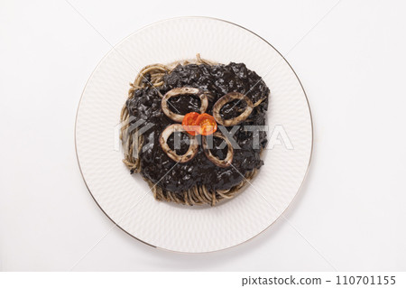 Pasta with black tomato sauce and squid and anchovies 110701155