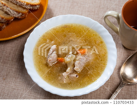 Shchi soup with beef served in bowl 110703433