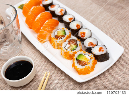 Set of maki and urumaki rolls and nigiri sushi 110703483