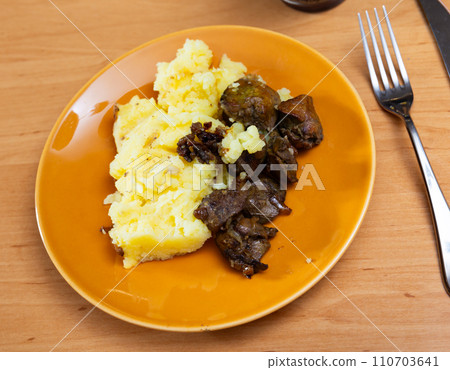 Chicken liver served with puree on plate 110703641