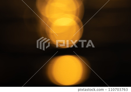 Yellow light bokeh on black background. Yellow light bokeh on black background. 110703763