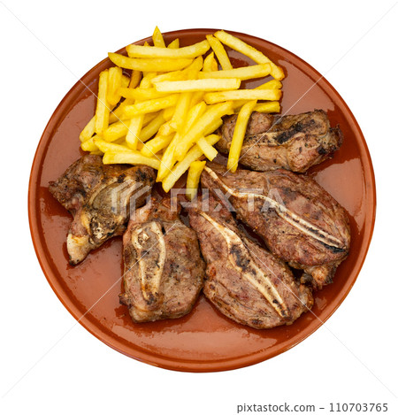 Dish with delicious appetizing baked pork cheeks with french fries for dinner close up 110703765