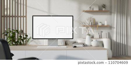 Interior design of a modern white home office workspace with a PC computer mockup on a desk. 110704609