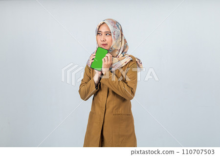 Young Indonesian Woman government employee wearing a brown uniform. Young Indonesian Woman government employee wearing a brown uniform. 110707503