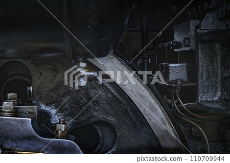 A durable steam engine made of black metal parts 110709944