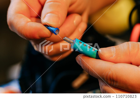 Male hands holding syringe with thermal paste close up Male hands holding syringe with thermal paste close up 110710823