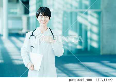 A female medical worker stands in the aisle. A female medical worker stands in the aisle. 110711562