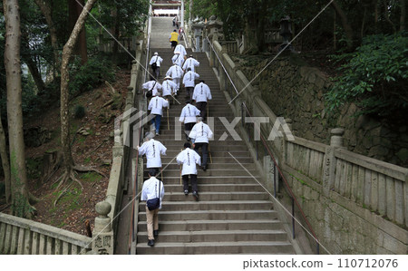 Kotohira Shrine, a pilgrim on a pilgrimage to Konpira walking up the Yodanzaka slope towards the main shrine 110712076