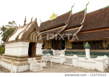 Many tourist enjoy sightseeing in Wat Xieng Thong Temple in Luang Prabang,Laos Many tourist enjoy sightseeing in Wat Xieng Thong Temple in Luang Prabang,Laos 110714122
