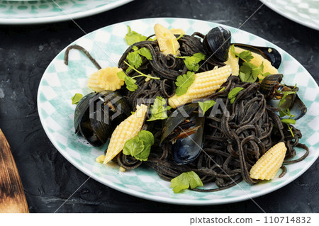 Black spaghetti pasta with mussels. 110714832