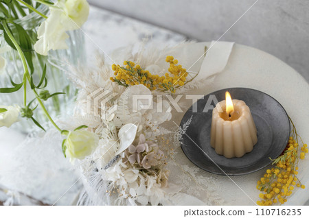 Candle and mimosa dried flower display 110716235
