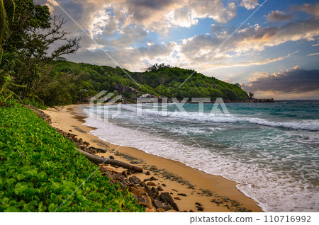 Tropical beach at Mahe Island, Seychelles, during sunset 110716992
