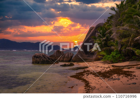 Colorful sunset over Anse Source D'argent beach at La Digue Island, Seychelles Colorful sunset over Anse Source D'argent beach at La Digue Island, Seychelles 110716996