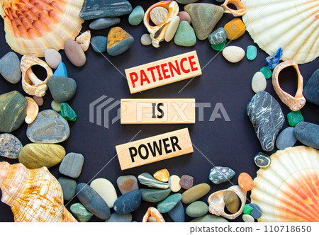 Patience is power symbol. Concept words Patience is power on beautiful wooden blocks. Beautiful black table black background. Sea shell stone. Business and patience is power concept. Copy space. 110718650