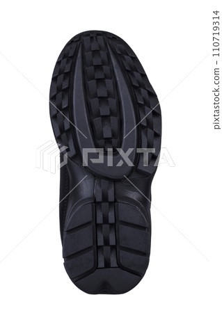 Black fluted shoe sole on a white background. Black fluted shoe sole on a white background. 110719314
