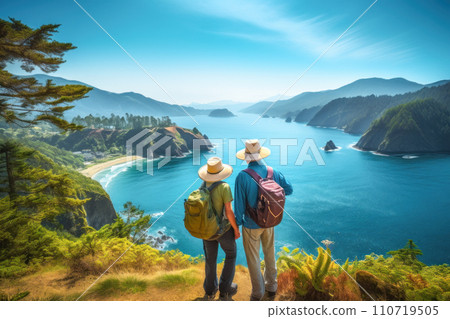 Senior couple with backpacks admiring the scenic  coast while hiking. AI content 110719505