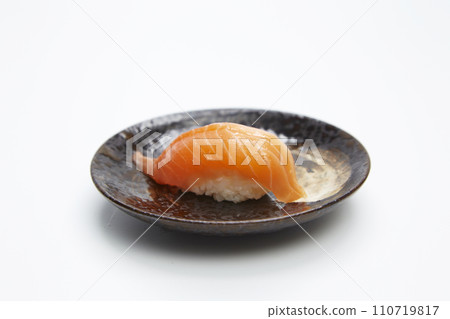 Japanese Cuisine, Salmon (sake) Nigiri Sushi on white background. Japanese Cuisine, Salmon (sake) Nigiri Sushi on white background. 110719817