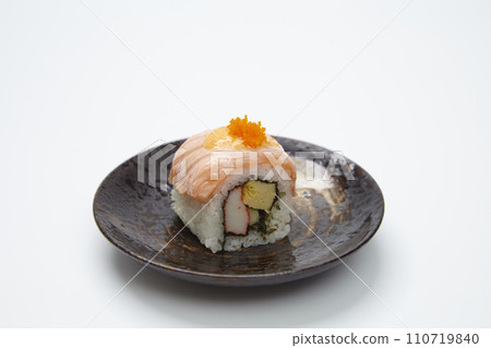 Roll made of salmon maki on white background. 110719840