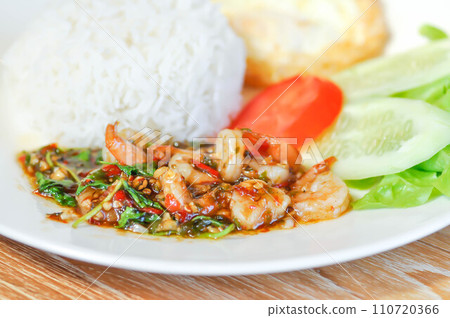 stir fried shrimp with holy basil and sunny side up egg or fried egg stir fried shrimp with holy basil and sunny side up egg or fried egg 110720366