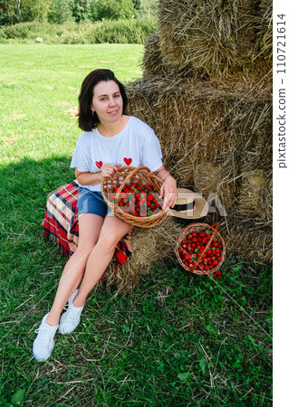 Portrait of Smiling Woman with Basket of Strawberries Portrait of Smiling Woman with Basket of Strawberries 110721614
