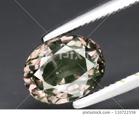 natural light purple sapphire gem on the background 110722356