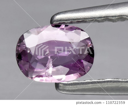 natural purple sapphire gem on the background 110722359