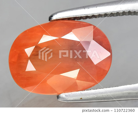 natural orange sapphire gem on the background natural orange sapphire gem on the background 110722360