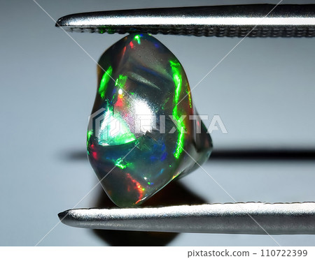 natural multi color rainbow opal rough gem on the background natural multi color rainbow opal rough gem on the background 110722399