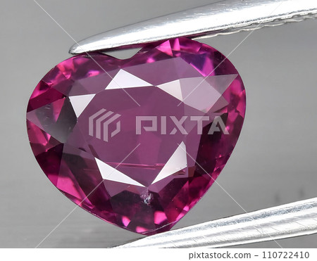 natural pink rhodolite gem on the background 110722410