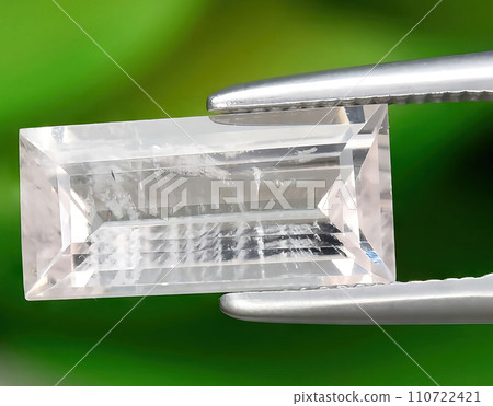 natural light pink morganite gem on the background 110722421