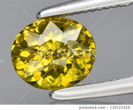 natural yellow grossular garnet gem on the background 110722428
