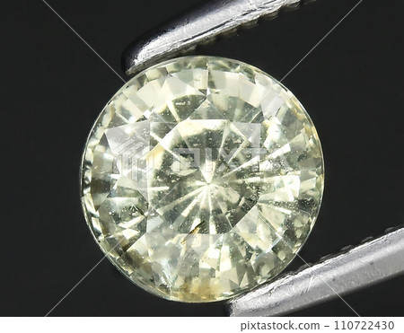 natural yellow grossular garnet gem on the background natural yellow grossular garnet gem on the background 110722430