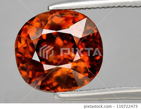 natural orange zircon gem on the background natural orange zircon gem on the background 110722473