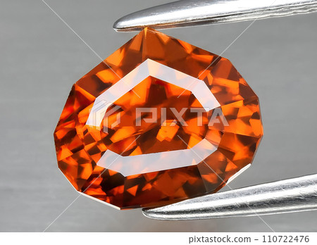 natural orange zircon gem on the background natural orange zircon gem on the background 110722476