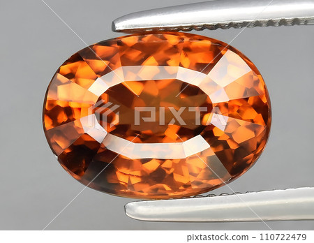 natural orange zircon gem on the background natural orange zircon gem on the background 110722479
