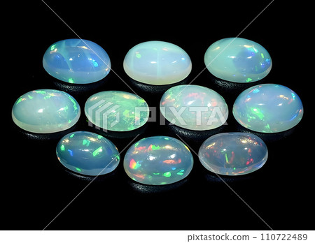 natural multi color rainbow opal gem on the background 110722489