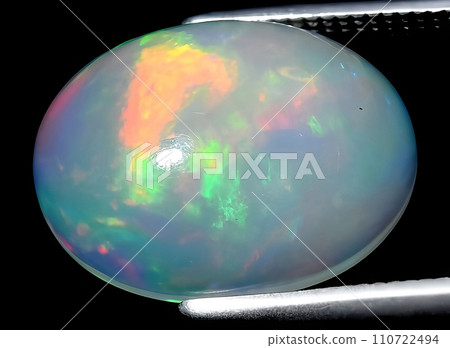 natural multi color rainbow opal gem on the background natural multi color rainbow opal gem on the background 110722494