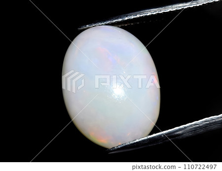 natural multi color rainbow opal gem on the background 110722497