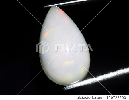 natural multi color rainbow opal gem on the background natural multi color rainbow opal gem on the background 110722500
