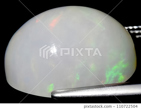 natural multi color rainbow opal gem on the background natural multi color rainbow opal gem on the background 110722504