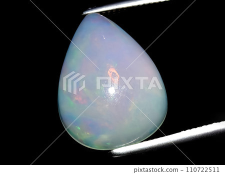 natural multi color rainbow opal gem on the background 110722511