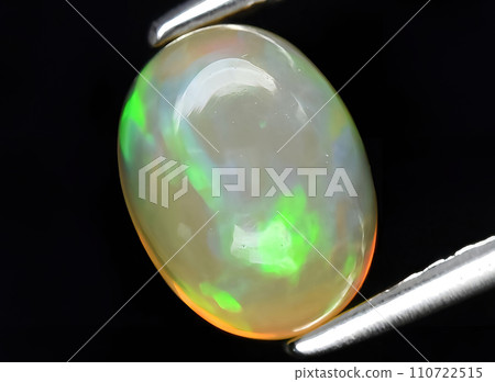 natural multi color rainbow opal gem on the background natural multi color rainbow opal gem on the background 110722515