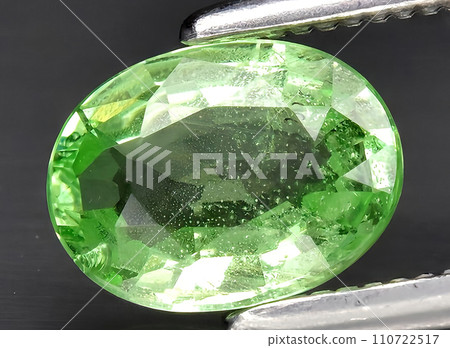 natural green tsavorite garnet gem on the background 110722517
