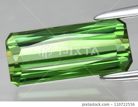 natural green tourmaline gem on the background natural green tourmaline gem on the background 110722556