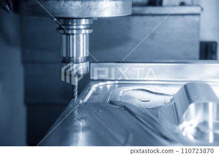 The CNC milling machine cutting press die part by solid bull end mill tool and G-code data background. The CNC milling machine cutting press die part by solid bull end mill tool and G-code data background. 110723870
